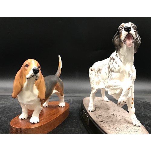 198 - Two Beswick matt pottery figures of dogs one a basset hound, on wooden plinth 15.5h the other a Sett... 