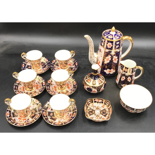 199 - A Royal Crown Derby Imari palette 2451 pattern coffee set comprising of six coffee cups and saucers,... 