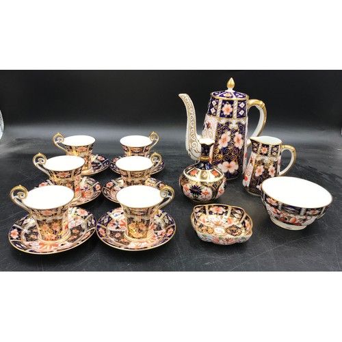 199 - A Royal Crown Derby Imari palette 2451 pattern coffee set comprising of six coffee cups and saucers,... 