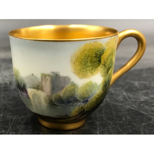 201 - A Royal Worcester Raymond Rushton coffee cup and saucer painted with castles by a river landscapes, ... 