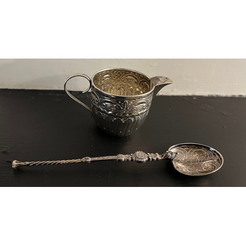 796 - An anointing spoon by Levi and Salaman, Birmingham 1901, a miniature embossed silver jug Birmingham ... 