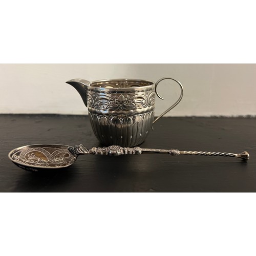 796 - An anointing spoon by Levi and Salaman, Birmingham 1901, a miniature embossed silver jug Birmingham ... 