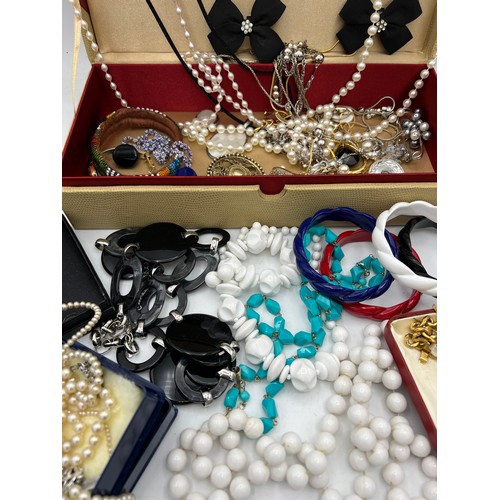 386 - A quantity of vintage costume jewellery to include watches, bead necklaces and bangles etc.