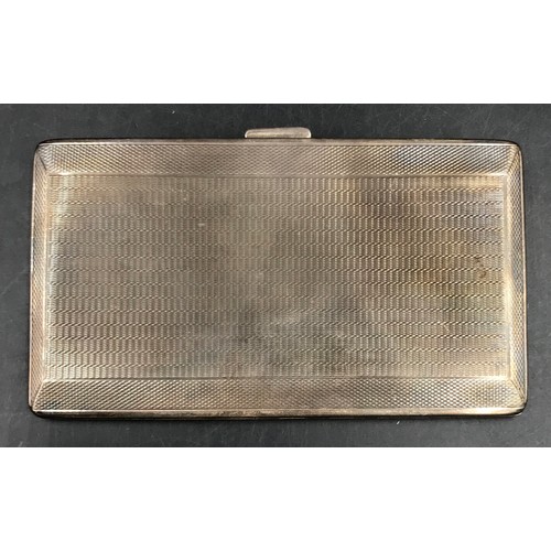 797 - A silver cigarette case hallmarked Birmingham 1953 Harman Brothers with vacant cartouche to top, tot... 