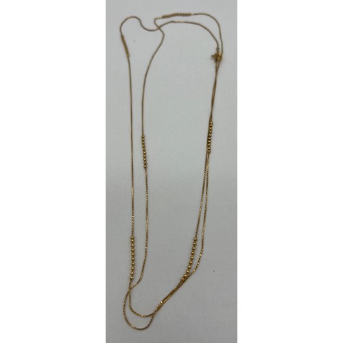 398 - A long fine gold necklace. Weight 3gm. Length 86cm.