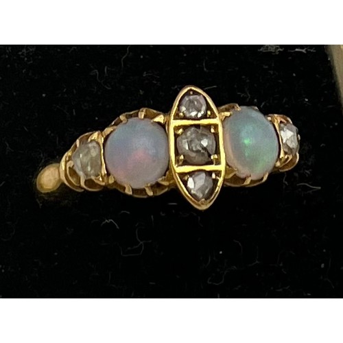 400 - An 18 carat gold, opal and diamond ring. Weight 3gm. Size Q.