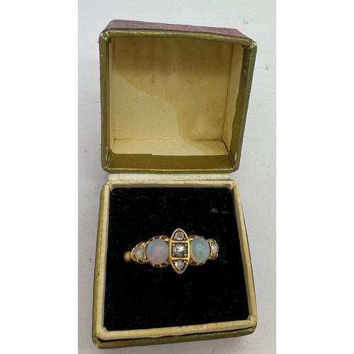 400 - An 18 carat gold, opal and diamond ring. Weight 3gm. Size Q.