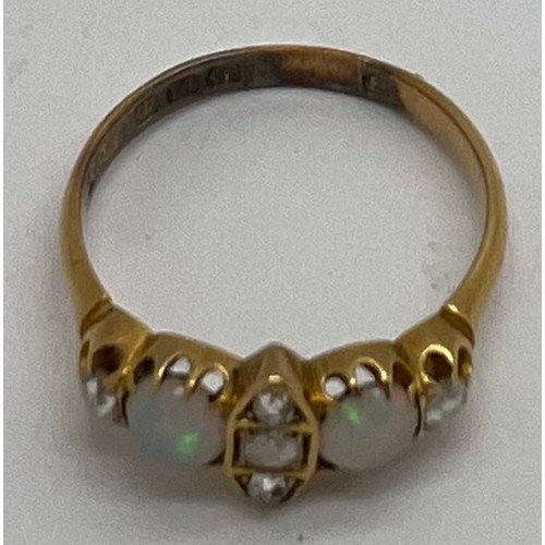 400 - An 18 carat gold, opal and diamond ring. Weight 3gm. Size Q.