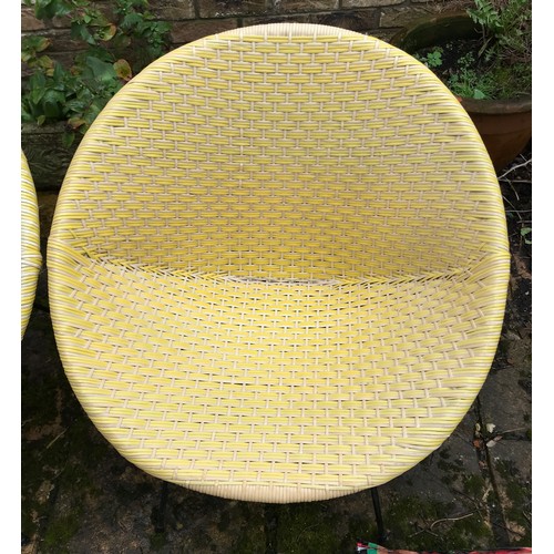 19 - Two 1970'S Conservatory egg shaped chairs on metalwork frames yellow in colour 75cm x 73cm.