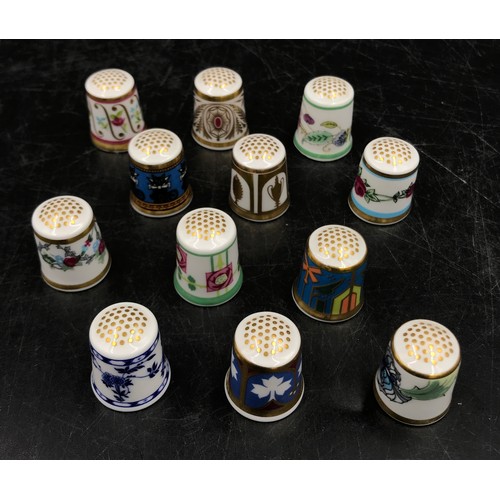 213 - A collection of ceramic thimbles to include 15x Royal Crown Derby all with certificates, a pair of l... 