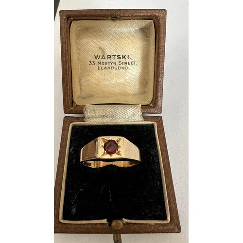 407 - A 9 carat gold ring set with single garnet. Weight 5gm, size P.