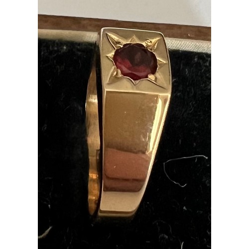 407 - A 9 carat gold ring set with single garnet. Weight 5gm, size P.