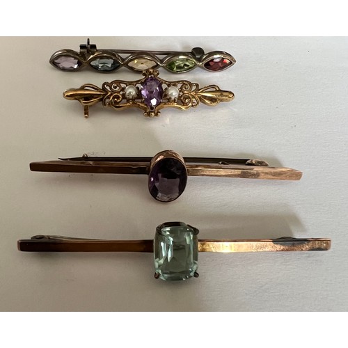 412 - Four various gem set bar brooches to include two 9ct, one silver and one in yellow metal.