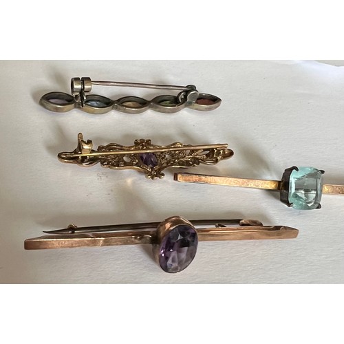 412 - Four various gem set bar brooches to include two 9ct, one silver and one in yellow metal.