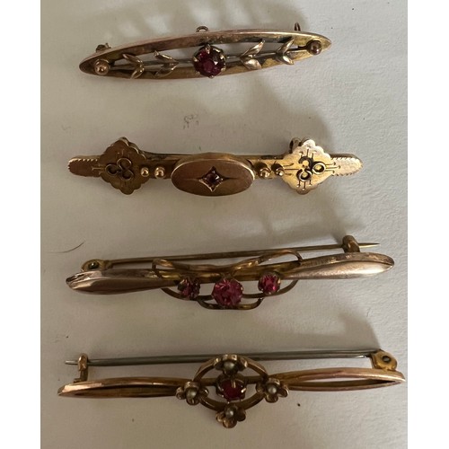 414 - Four various Edwardian bar brooches set with pink stones. Two marked 9 carat gold and two unmarked y... 