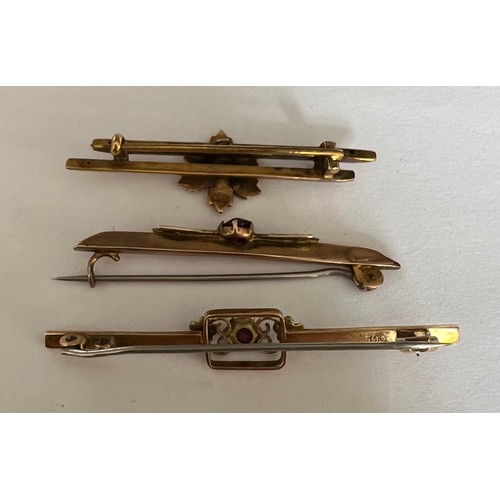 415 - Three Edwardian 9 carat gold bar brooches set with pink stones and seed pearls. Total weight  5.7gm.