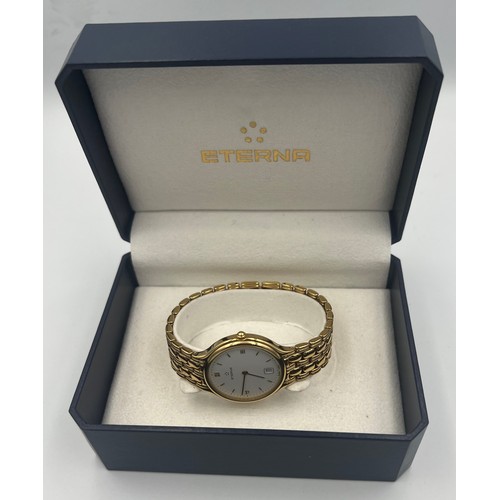 503 - A boxed gentleman's Eterna wristwatch with white dial and gold coloured strap.

Untested, may requir... 