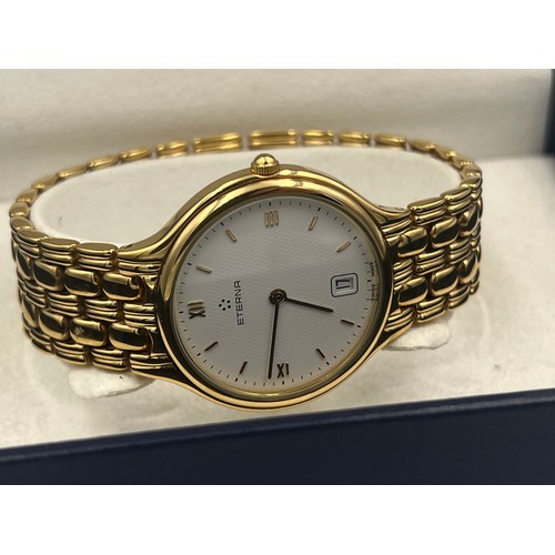 503 - A boxed gentleman's Eterna wristwatch with white dial and gold coloured strap.

Untested, may requir... 