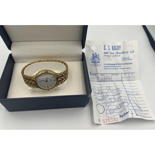 503 - A boxed gentleman's Eterna wristwatch with white dial and gold coloured strap.

Untested, may requir... 