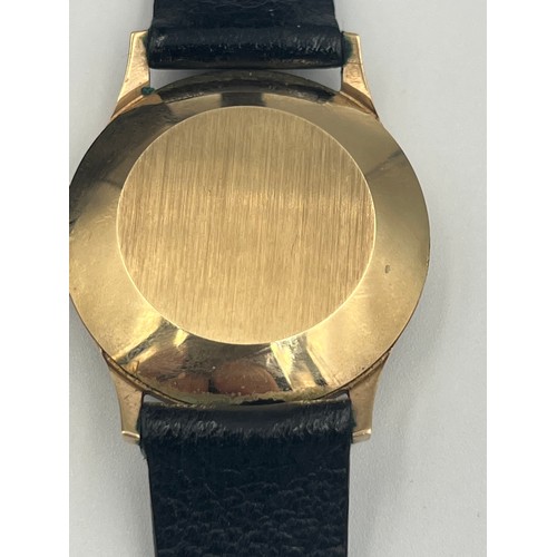 505 - A 9ct gold cased Garrard automatic date wristwatch with leather strap.

Winds and goes. Very good co... 