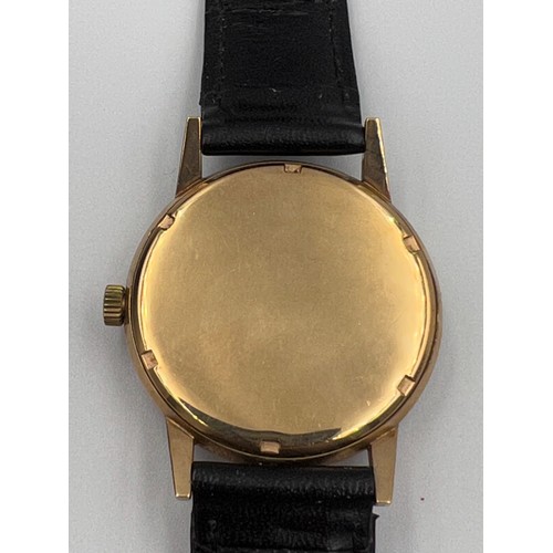 506 - An Astral 9ct gold cased automatic wristwatch with black leather strap.

Good condition, winds and r... 