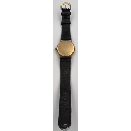 506 - An Astral 9ct gold cased automatic wristwatch with black leather strap.

Good condition, winds and r... 