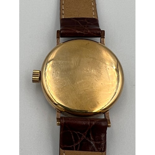 507 - A Vertex 9ct gold cased wristwatch with subsidiary seconds dial and brown leather strap.

Winds and ... 