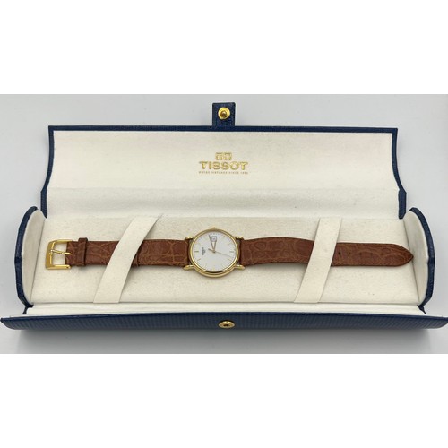 508 - An 18ct gold cased boxed Tissot wristwatch with brown leaf strap.

Winds and goes, very good conditi... 