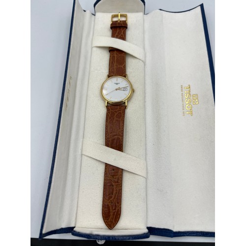 508 - An 18ct gold cased boxed Tissot wristwatch with brown leaf strap.

Winds and goes, very good conditi... 