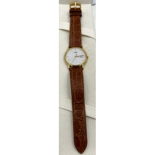 508 - An 18ct gold cased boxed Tissot wristwatch with brown leaf strap.

Winds and goes, very good conditi... 