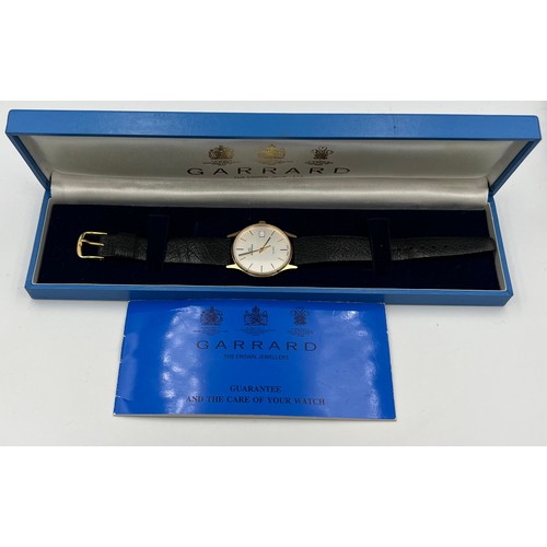 509 - A boxed 9ct gold cased Garrard wristwatch with leather strap.

Very good condition.