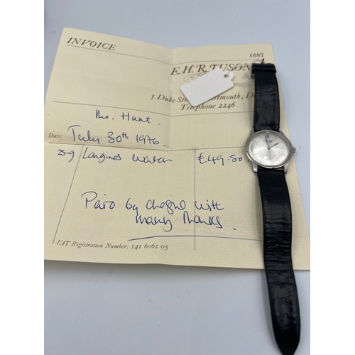 515 - A 1970's Longines manual wristwatch with silver face and leather strap.

Winds and goes. Very good c... 