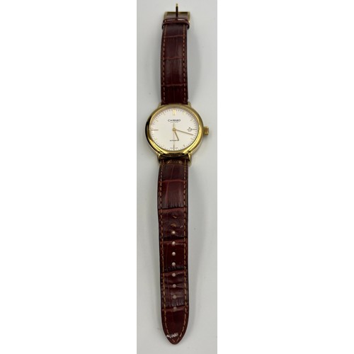 521 - A boxed Christopher Ward C5 GWK gentleman's date wristwatch on brown leather strap and skeleton back... 