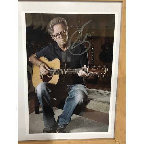 1279 - Signed and framed photograph and CD by Eric Clapton. Eric Patrick Clapton CBE (born 30 March 1945) i... 