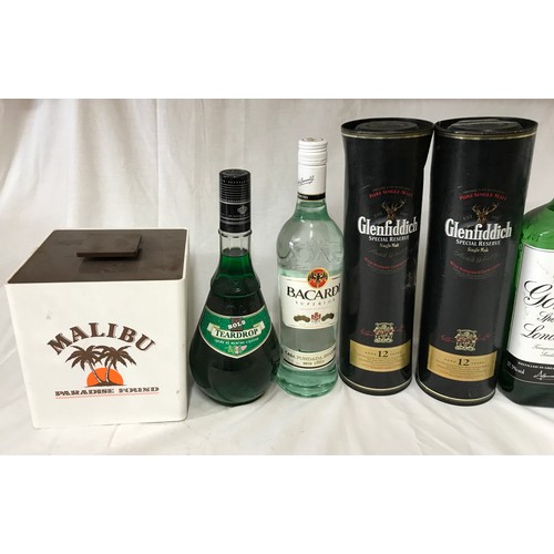 711 - Two bottles of 70cl Glenfiddich Special Reserve whisky aged 12 years along with a 70cl bottle of Bac... 