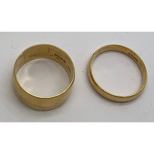 419 - Two 18 carat gold wedding bands, total weight 13.09. Sizes U and V.