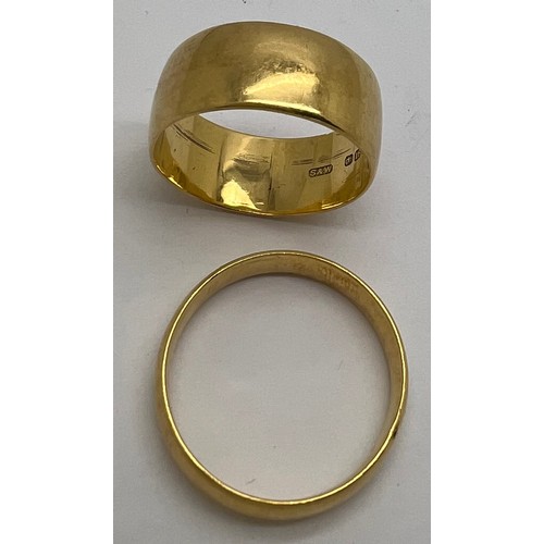 419 - Two 18 carat gold wedding bands, total weight 13.09. Sizes U and V.