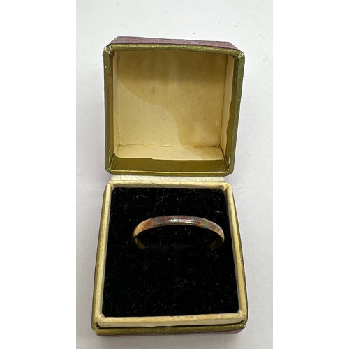 421 - A 22 carat gold wedding band. Weight 1.8gm. Size T.