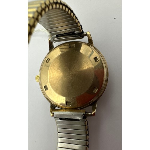 524 - A gentleman's 9 carat gold cased Rotary wristwatch with date aperture on gold plated expanding brace... 