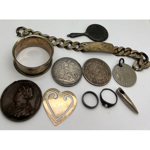 798 - A miscellany to include identity bracelet, hallmarked silver napkin ring, silver hand mirror photogr... 