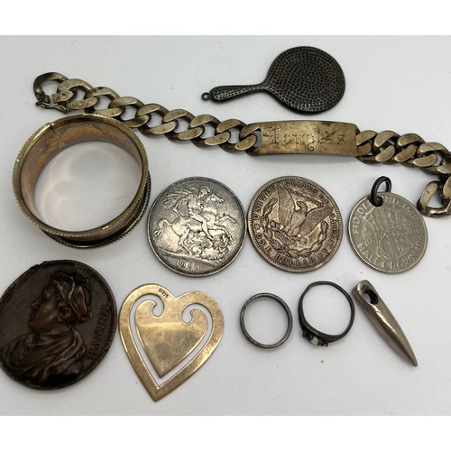 798 - A miscellany to include identity bracelet, hallmarked silver napkin ring, silver hand mirror photogr... 