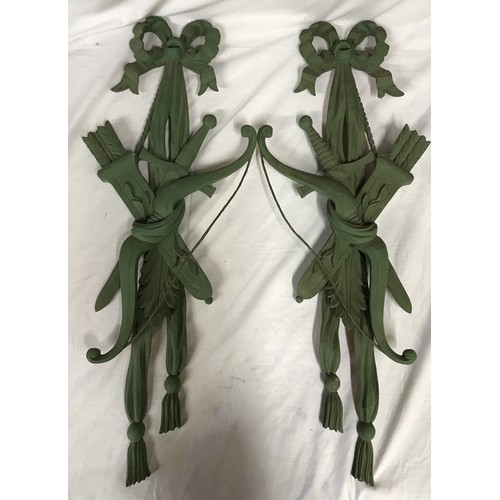 184 - Two matching pairs of ornamental carved wall decorations depicting arrows and a quiver painted green... 