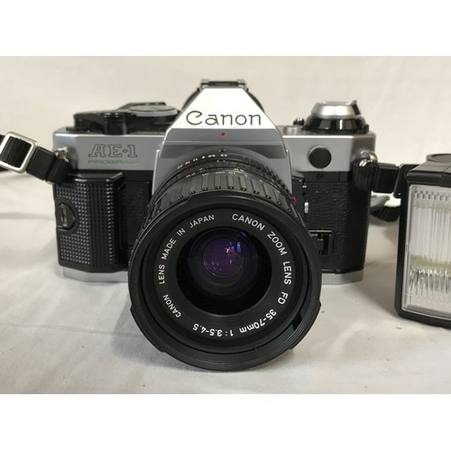 866 - A Cannon AE-1 Program camera with 35-70mm lens, with bag and flash.