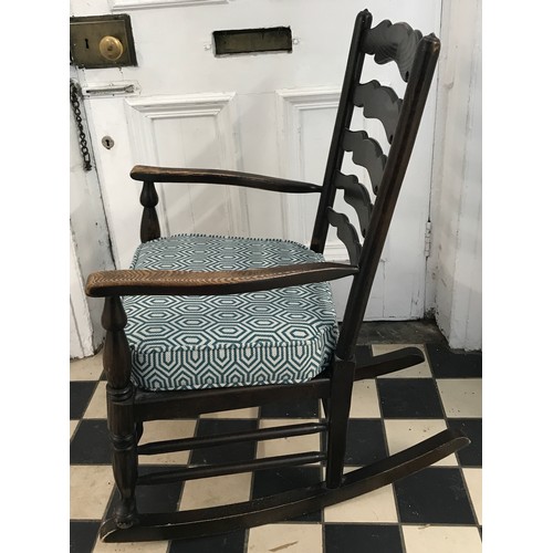 27 - Rocking Chair with a newly upholstered cushion on a plywood base 92cm h x 58cm w x 77cm depth to bac... 