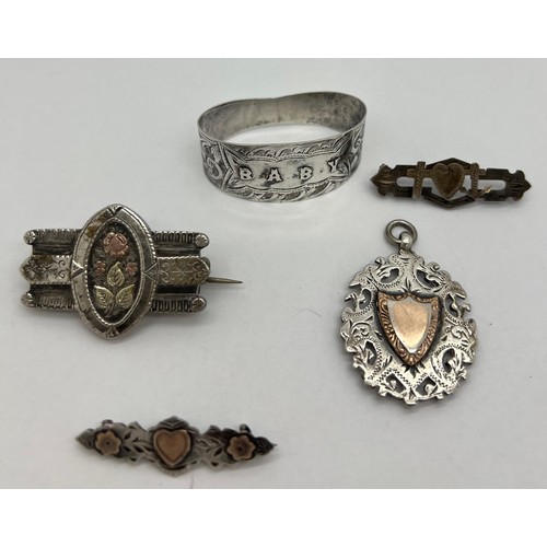 426 - Silver brooches, fob and ‘Baby’ napkin ring. Various dates and makers.