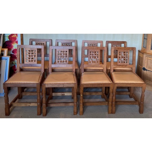 176 - Robert Thompson Mouseman Set of eight lattice back dining chairs with leather seats and carved signa... 