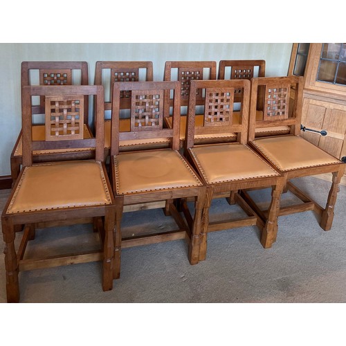 176 - Robert Thompson Mouseman Set of eight lattice back dining chairs with leather seats and carved signa... 