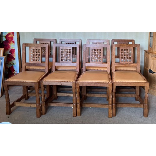 176 - Robert Thompson Mouseman Set of eight lattice back dining chairs with leather seats and carved signa... 