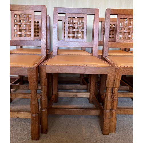 176 - Robert Thompson Mouseman Set of eight lattice back dining chairs with leather seats and carved signa... 