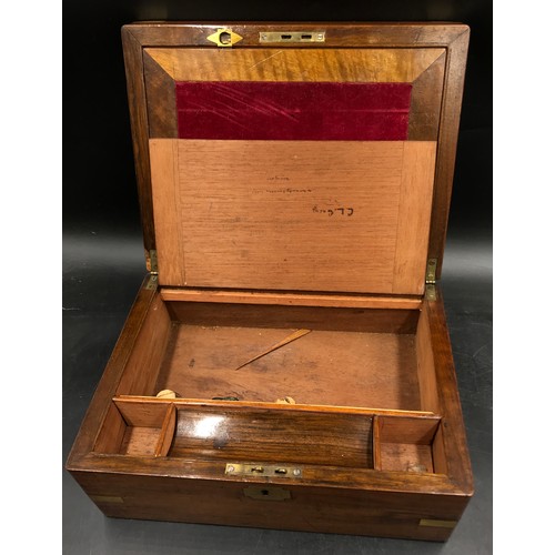 734 - A mahogany rectangular writing slope, with central brass cartouche, the red velvet interior with spa... 